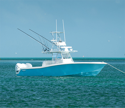 The ultimate 39 foot boat: Invincible's Open Fisherman mono-hull anchored.